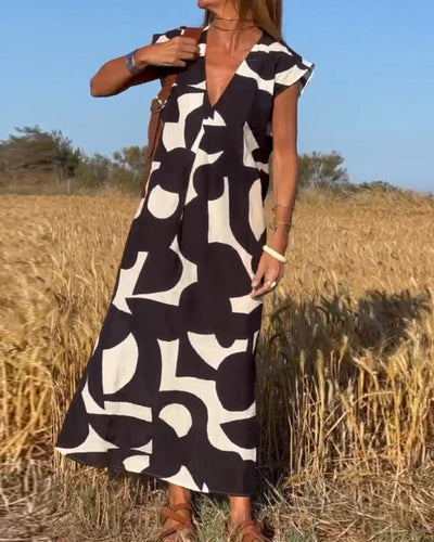 NAOMI | Langes Kleid mit V-Ausschnitt und ausgestelltem Schnitt für einen Urlaubslook
