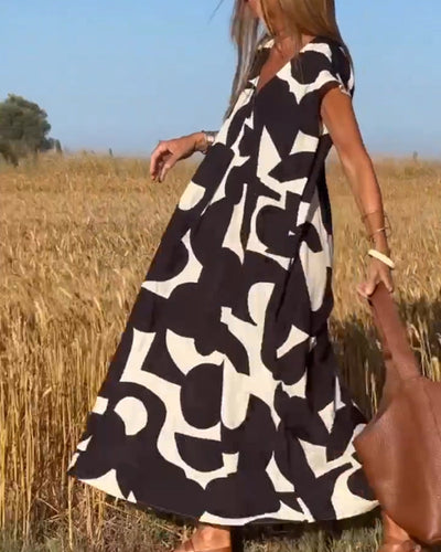 NAOMI | Langes Kleid mit V-Ausschnitt und ausgestelltem Schnitt für einen Urlaubslook