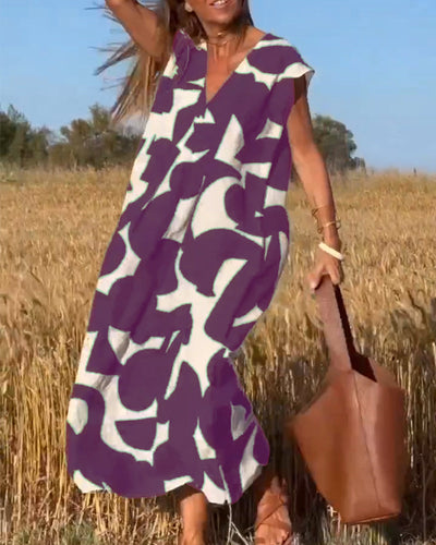 NAOMI | Langes Kleid mit V-Ausschnitt und ausgestelltem Schnitt für einen Urlaubslook