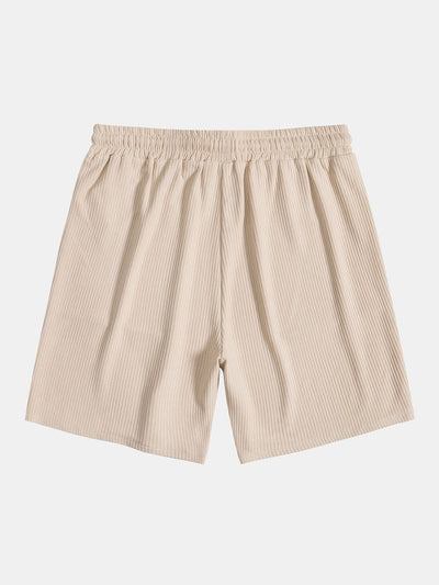 Strickpolo mit seitlichem Reißverschluss und Shorts