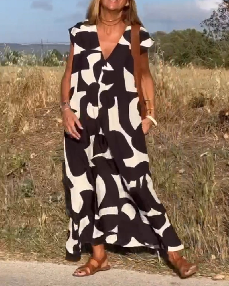 NAOMI | Langes Kleid mit V-Ausschnitt und ausgestelltem Schnitt für einen Urlaubslook