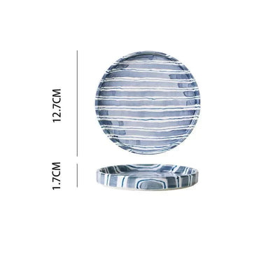 Handgezeichnetes gestreiftes Keramikbecher- und Untertassenset