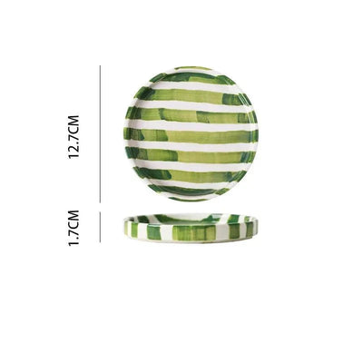 Handgezeichnetes gestreiftes Keramikbecher- und Untertassenset