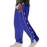 Herren nan weite Trackpants mit seitlicher Druckknopfleiste, elastischem Bund und reflektierendem Streamline-Streifen Drune in Königsblau