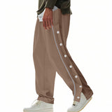 Herren nan weite Trackpants mit seitlicher Druckknopfleiste, elastischem Bund und reflektierendem Streamline-Streifen Drune in Braun