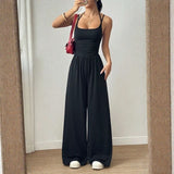 Bela™ Langer Jumpsuit mit weitem Bein, Doppelträgern und offenem Rücken in Schwarz