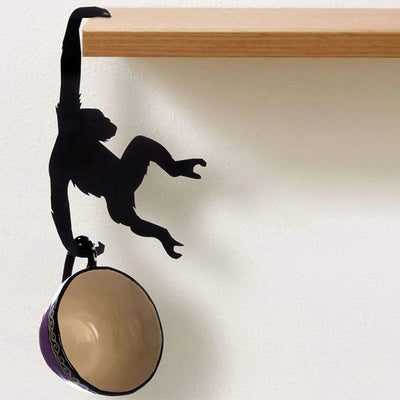 Verspielter Affen-Bananenhalter