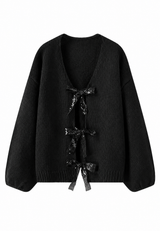 Damen-Strickjacke mit glitzernden Schleifen und V-Ausschnitt – Coronas in Schwarz